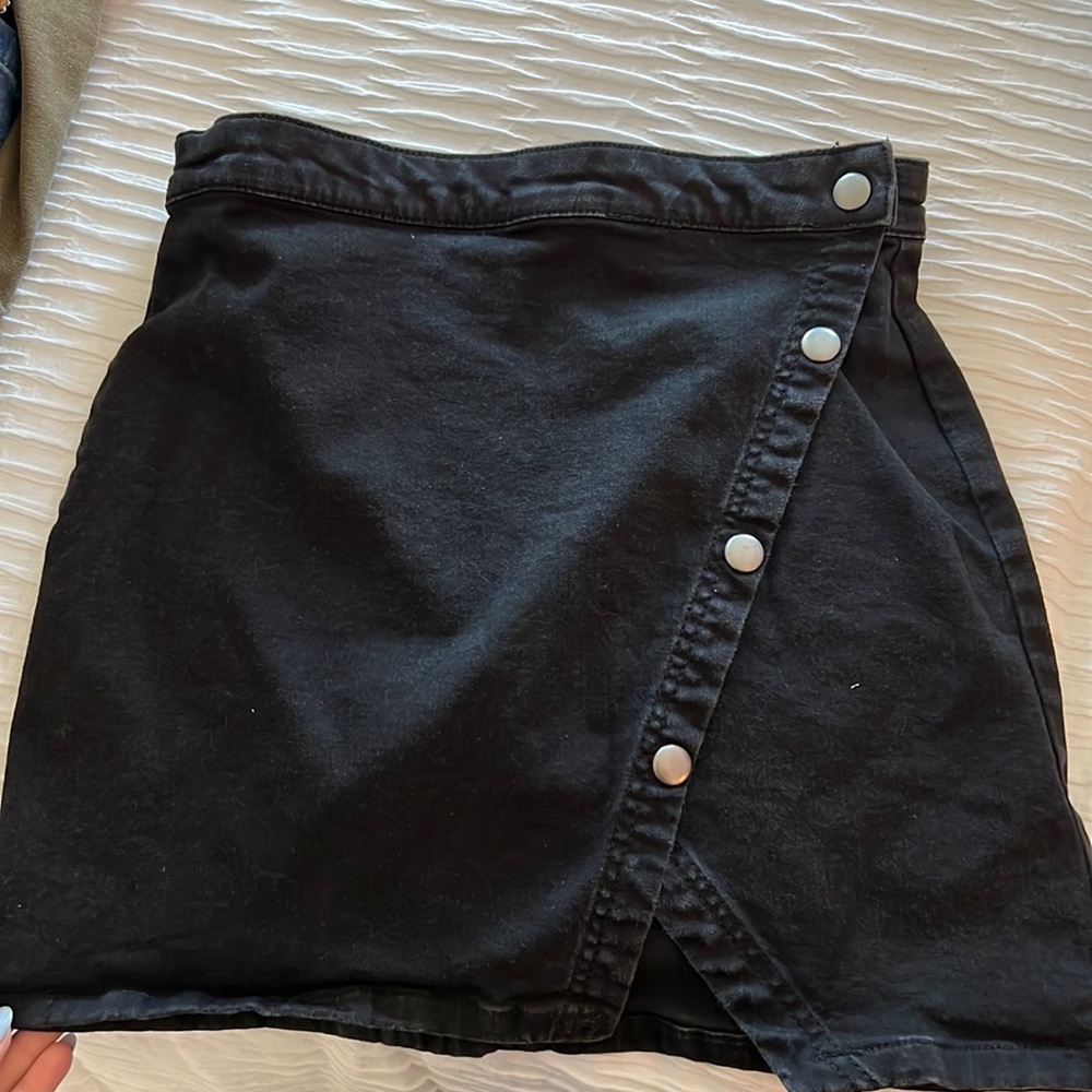 Free people black mini skirt. Snap open closure